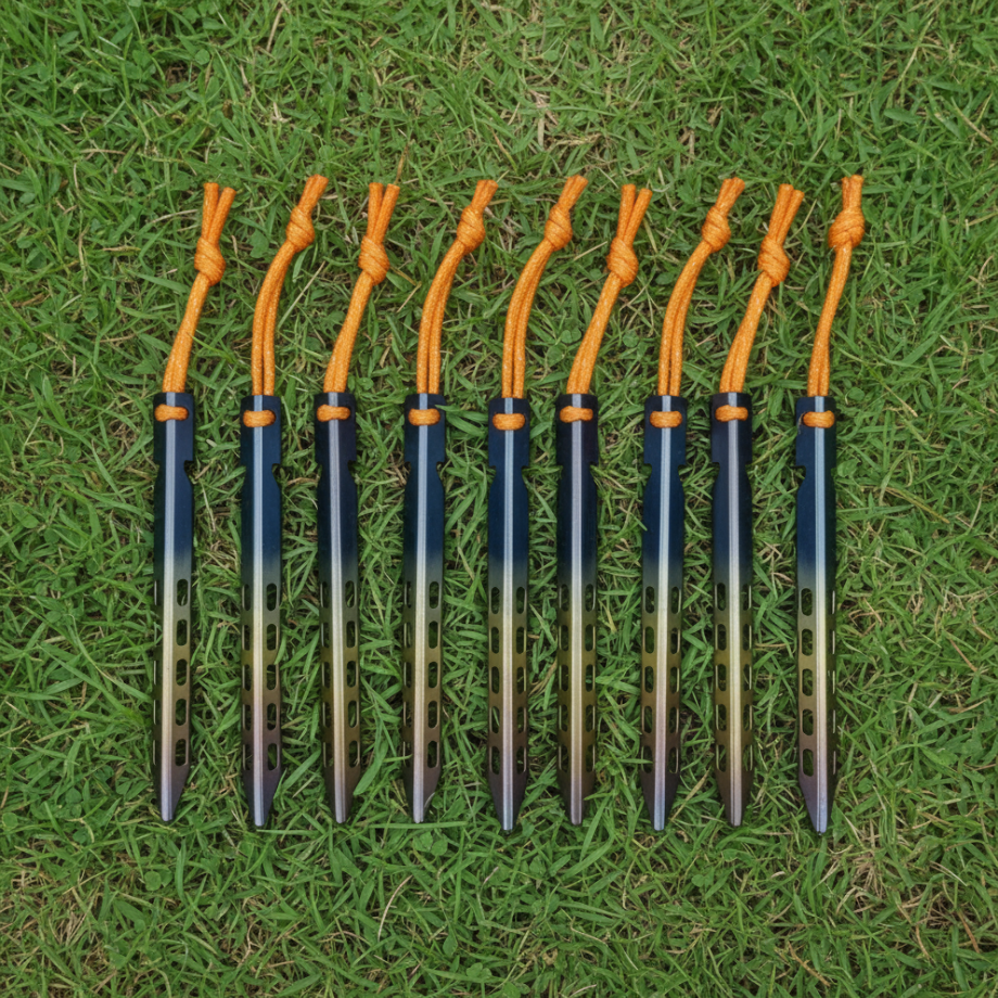Set of ten archery arrows with orange nocks on a grass background
