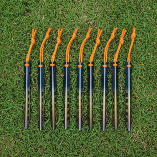 Set of ten archery arrows with orange nocks on a grass background